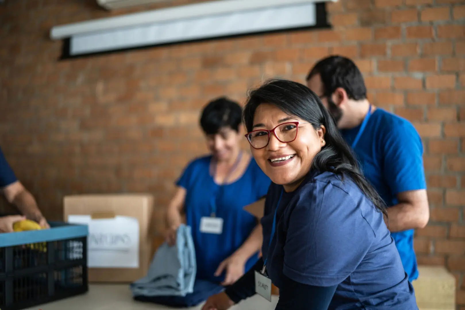 Volunteers organizing clothes at charity event